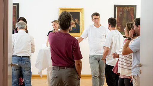 Teilnehmer:innen der Fachgruppentagung im Gespräch